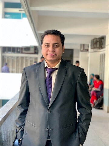 Photo of Iftekhar in suit and tie